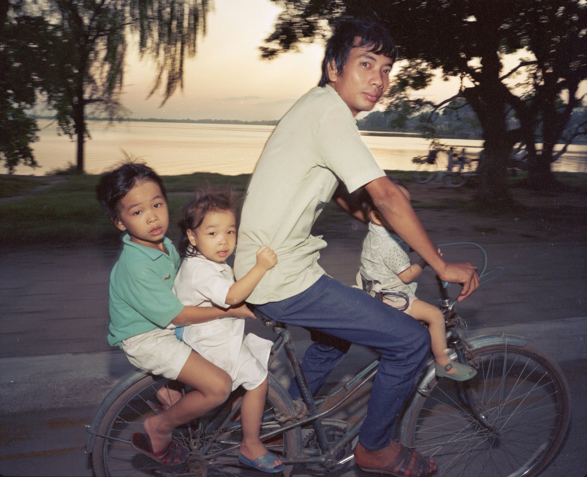 Motobike and Bicycles Going Home, 1987 © William E. Crawford