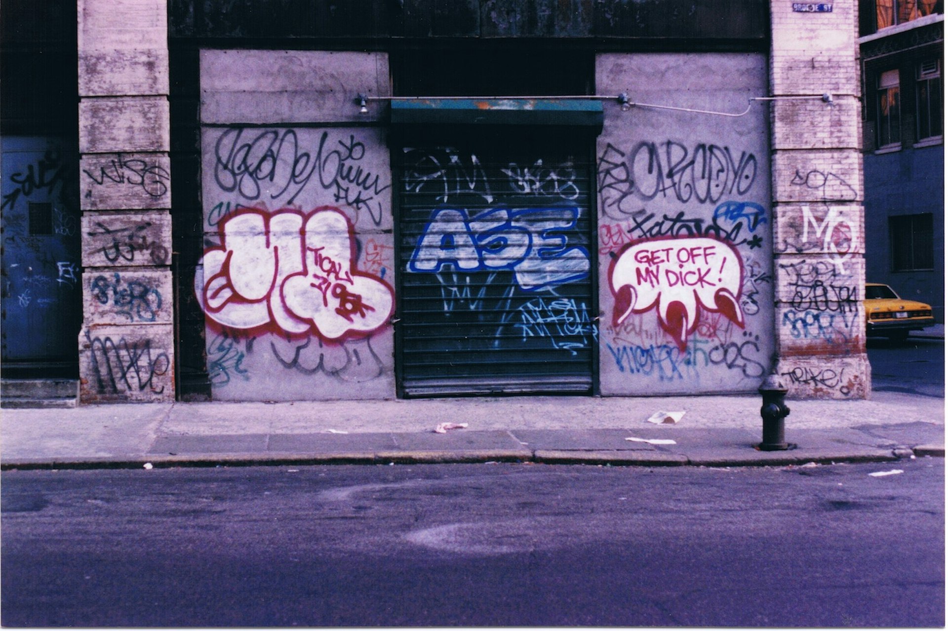 A streetside with graffiti tags