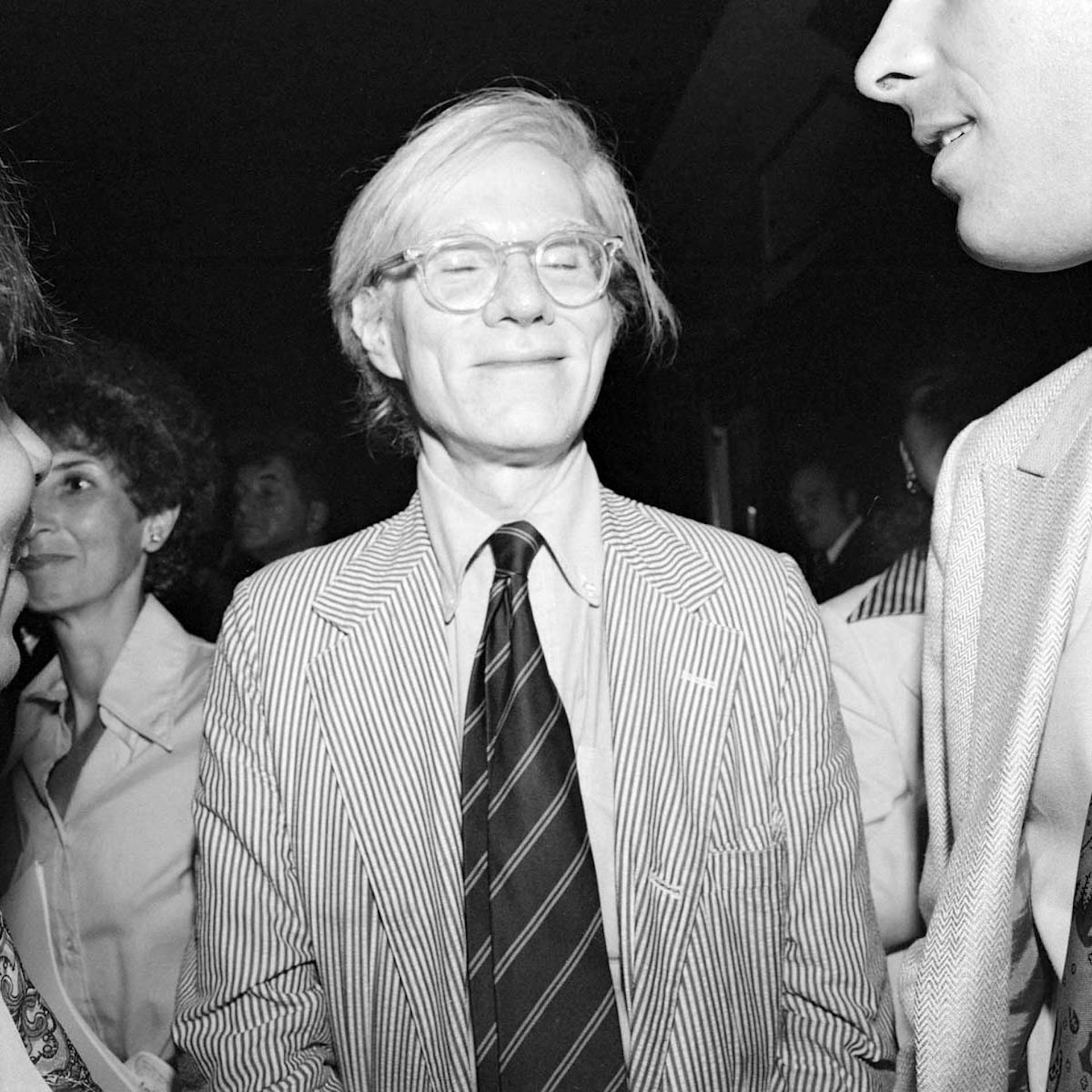 Warhol Eyes Closed (between his friend and Judi Jupiter), Studio 54, July 1977